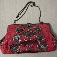 Beautiful Never Used Red Bag With Brass Studded And Sequence Design . The Inside Of This Bag Is Made Of Red Satin Material With A Single Pocket Where The Designers Name Is. The Bag Has A Unique Brass Chain Handle. This Is A Great Holiday Bag Or First For Those Who Love Boho. Thanks For Looking Red Crossbody Clutch For Party, Festive Red Clutch Evening Bag, Red Clutch Evening Bag For Festive Occasions, Festive Red Pouch Shoulder Bag, Red Crossbody Shoulder Bag For Party, Red Pouch Bag For Festive Occasions, Red Pouch Shoulder Bag For Party, Red Handheld Shoulder Bag For Party, Handheld Red Shoulder Bag For Parties