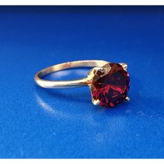 * Vintage Designer 14k Yellow Gold Round Red Quartz Solitaire January Ring * Ring Size: 6.0 * Top Of Ring Measures: 3/8" X 3/8" * Height: 3/8" * Band Measures: 1/16" * Red Quartz Total Carat Weight: Approximately 1.80 Tcw * Weight: 2.3 Tgw * Marked: 14k*Makers Mark * Condition: Great * G1059 Luxury Red Ring With Prong Setting, Classic Red Jewelry With Lab-created Ruby, Classic Red Lab-created Ruby Jewelry, Classic Red Jewelry With Round Cut, Classic Red Round Cut Jewelry, Classic Red Ruby Jewelry, Classic Round Band Lab-created Ruby Jewelry, Classic Lab-created Ruby Round Band Jewelry, Classic Red Birthstone Jewelry