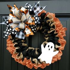 a halloween wreath with a ghost on it