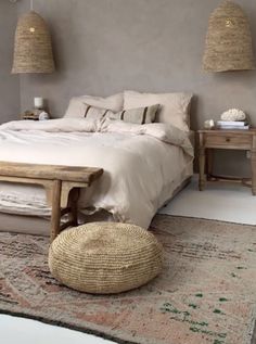 a large bed sitting in a bedroom on top of a rug