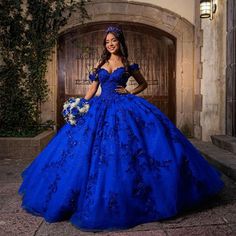 Ilaria, an majestic quinceanera dress, crafted from exquisite royal blue tulle fabric. Featuring an off-the-shoulder neckline and delicate appliqued embellishments, it exudes regal elegance. Complete with a sweeping train and lace-up back for a perfect fit, Ilaria promises to make your quinceanera unforgettable with its timeless beauty and grace. Details: Silhouette: Ball Gown Style Fabric: Tulle Fabric Color: Royal Blue Color Length: Sweep Train Neckline: Off the Shoulder Neckline Sleeves: Sleeveless Back: Lace-up Back Embellishment: Appliqued Quince Blue, Blue Quinceanera Dresses, Royal Blue Quinceanera, Quince Dresses Blue