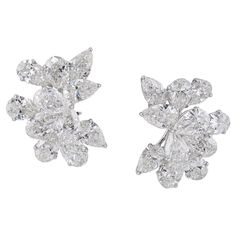 These exquisite diamond cluster earrings are a stunning display of luxury and elegance. Featuring 22 pear-shaped diamonds totaling approximately 17.44 carats, each stone boasts a weight of around 0.80 carats. The diamonds range from F to J in color and VVS to SI in clarity, ensuring a beautiful and sparkling appearance. All diamonds are GIA certified, guaranteeing their quality and authenticity. The earrings are crafted from 18k white gold, weighing 16.74 grams, adding a sophisticated touch to t Luxury Brilliant Cut Pear-shaped Cluster Earrings, Luxury White Gold Pear-shaped Cluster Earrings, Luxury White Pear-shaped Cluster Earrings, Luxury Diamond White Pear-shaped Chandelier Earrings, White Pear-shaped Cubic Zirconia Cluster Earrings, Earring Video, Diamond Chandelier, Diamond Chandelier Earrings, Diamond Cluster Earrings