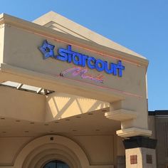 a close up of the front of a building with a sign for starcout music