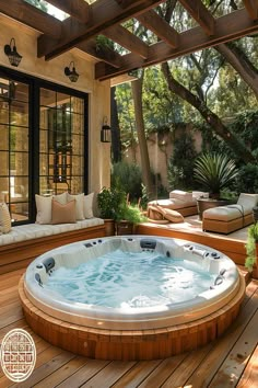 Luxurious outdoor hot tub with wooden deck and privacy screens under a pergola, surrounded by lush greenery. Sanctuary Design, Spa Landscaping