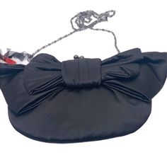 Macy’s. Small Black Small Evening Bag Or Clutch With 90’s Flare. Approximately 8”L X 6”H X .5”W. New With Tag But Has Some Tarnish On One Of The Metal Openings (See Pic) Bow On Front And Chain Style Crossbody. Chain Could Also Go Inside And Bag Could Be A Clutch. Leopard Print Interior With Slide Pocket. Black Vintage Bag For Gifts, Black Satchel Pouch For Evening, Elegant Black Handheld Pouch, Black Handheld Pouch For Party, Vintage Black Pouch Shoulder Bag, Black Rectangular Party Pouch, Rectangular Black Party Pouch, Black Formal Pouch Shoulder Bag, Black Pouch Bag For Night Out