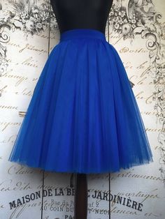 "Beautiful tulle skirt from soft Italian tulle for every day or special occasion. All skirts are made from 4-6 layers tulle, soft lining and elastic waistband for perfect fit and comfort. Each item are handmade and excelent quality. Usually tulle skirt sewing takes about 1 week. Shipping to US - 10 till 14 days, to UK - 5 till 7 days. If you need skirt for a specific date, please write it in the order notes. The model is 5.6ft tall and wears 26\" skirt length (6 layers). The length of the skirt Pleated Tulle Party Skirt With Lining, Party Tulle Pleated Flared Skirt, Tulle Pleated Flared Skirt For Party, Blue Long Tulle Skirt, Blue Tulle Long Skirt, Blue Long Tulle Skirt Dresses, Blue Long Tulle Dress, Blue Flared Tulle Skirt, Blue Tiered Tulle Skirt Dresses