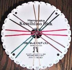 a white clock with red and green hands