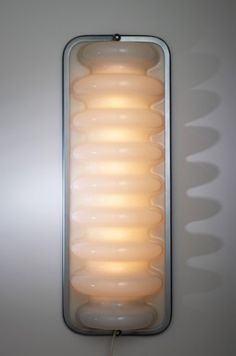 a wall mounted light that is on the side of a wall