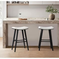 Enhance your kitchen's charm and comfort with Luna modern farmhouse saddle barstool, now featuring a plush, cushioned seat. Crafted from sturdy rubberwood, this stool combines durability with the luxury of a padded, curved saddle seat, making it ideal for both quick breakfasts and leisurely evenings. Its backless design, complete with a built-in footrest, is perfect for compact spaces, easily tucking away when not in use. Color: White. Quick Breakfasts, Saddle Bar Stools, White Bar Stools, Saddle Seat, Backless Bar Stools, Wood Stool, Boucle Fabric, Counter Bar Stools, Backless Design