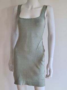 "Alaïa Spring/Summer 1992 stretch jersey sleeveless mini dress, scalopped knit neckline and hem, neckline sitting low across the bust. The colour is a beautiful seafoam, between pale blue and green. The knit is made to hug and exaggerate your every curve. Inspired by Versailles and the Marquise of Pompadour, Azzedine Alaïa's Spring 1992 iconic collection introduced pastel colours (pale blue, pale green, pink...) into the chromatic world of the meticulous craftsman. A demonstration of technical s Summer Stretch Mini Dress With Square Neck, Green Stretch Mini Dress With Square Neck, Green Fitted Square Neck Tank Top, Summer Bodycon Mini Dress With Scoop Neck, Green Square Neck Tank Top For Spring, Summer Scoop Neck Fitted Bodycon Dress, Scoop Neck Stretch Sleeveless Summer Dress, Green Fitted Mini Dress With Scoop Neck, Fitted Sleeveless Dress With Scoop Neck For Spring