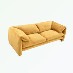 a yellow couch sitting on top of a white floor