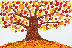 a child's drawing of a tree with red, yellow and orange leaves on it