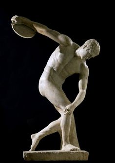 a statue of a man holding a basketball in his right hand and standing on one leg