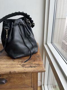 "For more handmade leather bags, purses, satchels, messengers, travel bags, holdalls, carry alls, handbags, shoulder bags, click here: http://etsy.me/1muiXbL. Mini bucket bag is a great little drawstring handbag that is made out of soft cognac leather and bridle leather strap. Its easily opened and closed with the leather drawstring and can fit an iPad mini if stretched opened. The strap is long and will fit most and comes with adjustable leather option. Made to order made from scratch leaving r Luxury Bucket-shape Shoulder Bag For On-the-go, Chic Bucket Bag With Leather Lining For On-the-go, Luxury Bucket Bag For Errands, Leather Bucket Satchel For On-the-go, Luxury Crossbody Bucket Bag For Errands, Luxury Bucket Bag With Detachable Strap For Everyday, Luxury Bucket Hobo Bag For Errands, Luxury Bucket Shape Hobo Bag For Errands, Luxury Soft Leather Bucket Shoulder Bag