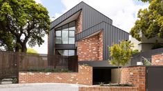 a modern house with brick and steel exterior