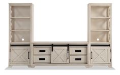 a white entertainment center with two doors and drawers on the front, one door open