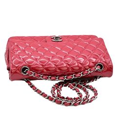 Elevate your style with the iconic Chanel CC Matelasse 25 Chain Shoulder Bag in vibrant red patent leather. The exquisite diamond quilting and signature CC logo bring a touch of sophistication to any outfit. The stunning silver-tone hardware adds a modern edge to this timeless piece. With its versatile chain strap, this bag seamlessly transitions from day to night, making it a must-have accessory for any fashion enthusiast. Experience luxury and elegance with the Chanel CC Matelasse 25 Chain Shoulder Bag. Fashion Enthusiast, Chanel Model, Prada Crossbody, Prada Crossbody Bag, Diamond Quilt, Cc Logo, Chain Shoulder Bag, Casual Backpack, Chanel Handbags