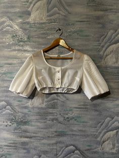 "Vintage 80s Crop Top White Oktoberfest Blouse Cropped Dirndl Blouse Women 3/4 Sleeve Tyrolean Blouse Austrian Top Medium Size Label size: 38 Estimated size: M Measurements: (lying flat) Length: 23\" / 59 cm Shoulders: 14,5\" / 37 cm Bust: 17,5\" / 44 cm Sleeve: 12\" / 31 cm Please check measurements to insure a proper fit. Remember to allow yourself some extra room for movement. You can compare these with something from your closet that fits you well. This blouse will come to you freshly launde White Half Sleeve Blouse With Buttons, Summer Blouse With 3/4 Sleeves And Button Closure, Short Sleeve Unstitched Summer Blouse, Unstitched Short Sleeve Blouse For Summer, Vintage Fitted Blouse With Gathered Sleeves, Elegant Half Sleeve Blouse For Daywear, Classic 3/4 Sleeve Daywear Blouse, Classic 3/4 Sleeve Blouse For Daywear, Fitted White Half Sleeve Blouse