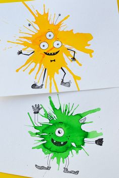 two children's handprints with green and yellow paint on them, one has an image of a monster