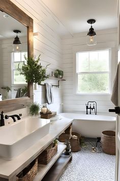 a bathroom with a tub, sink and mirror