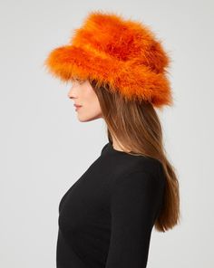 Luxurious marabou feathers find a new home in this bucket hat. Not only does it keep you warm in cooler months, it makes a stylish addition to brunch or lunch on the town. Marabou Feathers, Jumpsuit Jacket, Outerwear Vest, Fall Collections, Sweater Skirt, Jacket Tops, Skirt Pants, Vest Jacket, Sweater Top