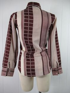 "Vintage 1970s women's disco shirt, mod blouse. Made of polyester. Color is burgundy and white. Has button down front and button cuffs. Made by Stitches. About a size medium. Actual measurements are: 35\" around the bust 30\" around the waist 14\" shoulder seam to shoulder seam 22.5\" shoulder seam to end of cuff 27\" overall length In very good condition." Retro Fitted Brown Blouse, Fitted Retro Brown Blouse, Fitted Brown Tops In 1970s Style, Fitted Brown Tops 1970s Style, Fitted Brown 1970s Style Tops, Fitted Cotton Blouse With Retro Print, Fitted 70s Inspired Tops For Fall, Fitted Retro Print Button-up Blouse, Fitted Collared Tops Inspired By 70s