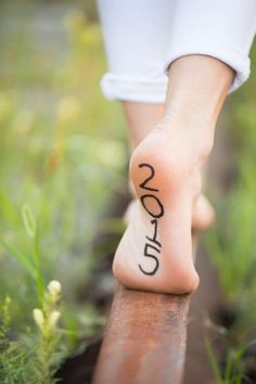 a close up of a person's foot with the word love written on it