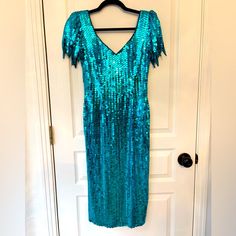 Vintage Stunning Turquoise Sequins Midi Dress Size 6 Nwt By Peak Evenings Love The V Neck Back And Flutter Sleeves. I’ve Had This For A While And Keep Hoping It Will Fit But It’s Too Big. Approx: 15 Ptp 13 Waist 42 Length Turquoise Evening Dresses With Sequins, Fitted Turquoise Midi Dress For Party, Blue Short Sleeve Dress For Party Season, Blue Sequin Knee-length Dress, Blue Knee-length Sequin Dress, Turquoise Knee-length Party Dress, Elegant Turquoise Knee-length Dress, Elegant Knee-length Turquoise Dress, Elegant Turquoise Sequin Dress