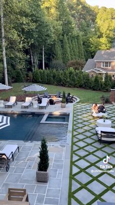 an image of a backyard with pool and patio furniture