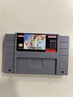 an old nintendo game that is hanging on the wall