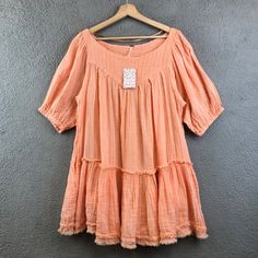 New Free People Tunic Top Orange Mystery Land Shirt Coral Size Small Condition ~The Top Is New With Tag Attached. From Nonsmoking Environment. No Stains, Snags, Pilling, Odors, Or Excessive Signs Of Wear Unless Specifically Noted. Please See The Photo For Measurements. Shipping: Fast Shipping. All Items Will Be Shipped Within 1 Business Day Of Payment (Which Excludes Weekend And Holidays). Orange Short Sleeve Blouse For Spring, Orange Relaxed Fit Blouse For Vacation, Breezy Short Sleeve Cotton Blouse, Breezy Cotton Short Sleeve Blouse, Summer Orange Cotton Blouse, Flowy Cotton Blouse For Spring, Orange Cotton Blouse For Summer, Bohemian Short Sleeve Blouse For Spring, Spring Breezy Relaxed Fit Blouse