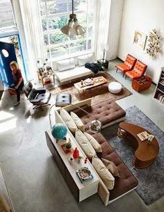 an overhead view of a living room with couches and chairs