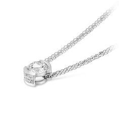 Modern and sophisticated, this necklace is a captivating look any woman would adore. Beautifully crafted, this ring features a dazzling 0.77 carat center stone placed prominently in an 18K white gold half-bezel setting that enhances the diamond's size and sparkle.  This classic look is one she'll turn to often, everyday and on special occasions. An amazing and thoughtful anniversary gift for your loved one.
0.77 Classic diamond pendant set in 18K white gold
Center Diamond:&nb Modern Diamond White Round Cut Diamond Necklace, Modern Round Cut Diamond White Necklace, Modern Diamond White Necklace With Brilliant Cut, White Solitaire Necklace With Diamond Cut Round Pendant, Timeless Diamond White Round Pendant Necklace, White Gold Solitaire Necklace With Bezel-set Round Stone, Timeless White Solitaire Necklace With Single Cut Diamonds, White Diamond Necklace With Round Pendant Accents, White Diamond Necklace With Round Pendant