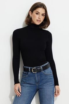 This rib knit turtleneck top is designed for a bodycon look. Features - Mother-of-pearl buttons - Long sleeves - Buttoned cuffs Size & Fit - Bodycon fit - Model is wearing size XS Materials & Care - 60% Viscose, 25% Nylon, 15% Polyester - Hand wash, cold - Imported Ribbed Turtleneck Outfit, Black Turtle Neck Sweater, Black Turtleneck Outfit, Closet Outfits, Turtleneck Sweater Outfit, Black Turtle Neck, Turtleneck Outfit, Knit Turtleneck, Turtleneck Top