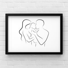 a black and white drawing of two people hugging each other in front of a brick wall