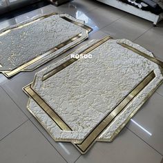 two large mirrors sitting on top of a tiled floor