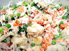 a salad with peas and carrots in a bowl