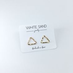 Our Triangle Stud Earrings are ideal for minimalists and everyday wear and are available in your choice of fine metal: Sterling Silver, 14k Gold Fill or Rose Gold Fill. In the drop down menu you may choose your preferred metal. NOTE: This listing is for ONE pair of stud earrings only. All White Sand Jewelry comes in a hand stamped gift box ready for gifting. PROCESSING TIME: Each piece is handcrafted and made-to-order, specifically for you. Although I do my very best to get orders out as quickly Minimalist Metal Wrap Earrings, Minimalist Metal Wrap Earrings Gift, White Drop Cartilage Earrings For Everyday, Simple Nickel-free Metal Earrings, White Minimalist Metal Hoop Earrings, Minimalist White Pierced Cartilage Earrings, White Minimalist Cartilage Earrings, Everyday White Drop Cartilage Earrings, Minimalist White Cartilage Earrings