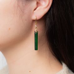 A pair of lovely long green jade earrings comes with gold hooks. Made with quality long and cubic emerald-like green hanging jade drops. The minimalist design suits most occasions. Some highlights of this elegant and fancy dangle silver jade earrings are: *High-quality materials Quality green jade, delicate carving details, 925 sterling silver. Makes a perfect gift for yourself or friends. *Simple style Simple but basic design suits many occasions and works great on many outfits. *Measurements E Jade Gold Jewelry, Cheap Green Earrings With French Hook, Green Jade Earrings For Pierced Ears, Jade Drop Earrings With Ear Wire, Jade Earrings With Ear Wire For May Birthstone, Elegant Handmade Green Linear Earrings, Green Long Drop Earrings, Single Green Long Drop Earring, Green Single Long Drop Earring