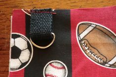 a close up of a cell phone case with a ball and baseball on it,