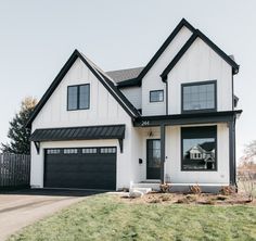 a white house with black trim and windows