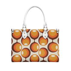 * Mid Century Handbag: Crafted from premium PU leather, this handbag embodies the chic and timeless style of the mid-century era. * Mod Purse: A perfect accessory for those who appreciate the bold and vibrant mod fashion of the 60s. * 60s Style Handbag: This handbag features a striking orange opt art pattern, bringing the distinctive space age design of the 60s to life. *Orange Purse: The vivid orange color adds a pop of retro flair, making it a standout piece for any vintage-inspired wardrobe. Modern Orange Double Handle Shoulder Bag, Modern Orange Bag With Top Carry Handle, Retro Satchel With Leather Handles, Retro Leather Box Bag With Top Handle, Retro White Leather Shoulder Bag, White Retro Satchel With Detachable Strap, Retro Leather Top Handle Box Bag, Orange Top Handle Satchel With Detachable Handle, Modern Orange Rectangular Satchel