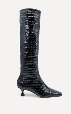 The Maverick Calf Boot is made from 100% Chrome-Free Calf Nappa Leather with a luxuriously thick embossed crocodile print texture. This style features a cowboy cut out contrast panel over the toes with heavy stitch detailing, soft suede lining, a straight cut relaxed leg and a squared Victorian undercut 50mm leather covered heel.The leather used in this design while thick, is very soft and can be worn pulled up as a straight but relaxed style or can be pushed down for a scrunched boot effect. The soft suede lining ensures this style is luxuriously soft but should be worn with slim stockings to allow for easy wear.This style is a standard fit. Made from 100% Chrome-Free Calf Nappa Leather. To prevent premature ageing/staining we recommend using a quality leather protector that is free from Luxury Calf Leather Lace-up Heeled Boots, Luxury Fitted Boots With Crocodile Pattern, Luxury Classic Boots With Crocodile Pattern, Luxury Black Calf Leather Lace-up Boots, Crocodile Embossed Boots, Print Texture, Crocodile Print, Boot Accessories, Calf Boots