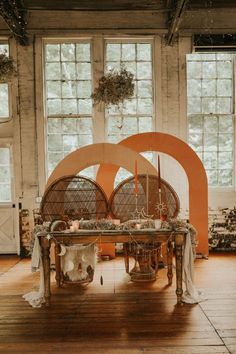 the table is set up in front of two large windows