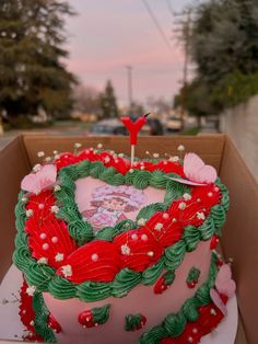 a heart shaped cake in a cardboard box