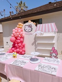 a hello kitty themed birthday party with balloons