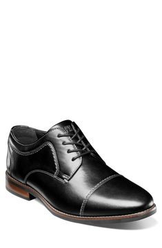 Clean topstitching lends handsome style to this sleek derby shaped by a classic cap toe. Synthetic upper and lining/rubber sole Imported Casual Cap Toe Dress Shoes For Business, Casual Cap Toe Business Dress Shoes, Classic Black Dress Shoes With Cushioned Footbed, Casual Black Cap Toe Oxfords, Classic Fitted Black Derby, Casual Black Cap Toe Dress Shoes, Casual Black Dress Shoes With Cap Toe, Casual Goodyear Welted Cap Toe Oxfords, Casual Cap Toe Oxfords With Goodyear Welt