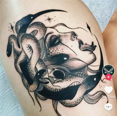 a woman's thigh with an octopus and fish tattoo on the side of her leg