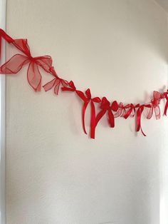 Red bows garland for wall decoration. Great for Christmas decor  📏Approximate measurements:  The total length is approximately 5.5- 6 feet long with 15 bows  Please be noted that: - As these are handmade items, pattern/details/sizes may vary on each one and may not necessarily look the same as in the pictures.  - The colour may appear differently due to phone/computer-monitor screen settings. - These items are for decoration and are not toys. Red Bow Garland, Diy Valentines Day Decor, Valentine’s Day Garland, Paper Chain Decorations, Ribbon Wall Decor, Bows Garland, Valentines Decor Diy, Diy Valentines Decor, Ribbon Bunting