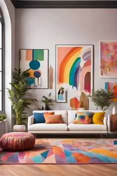 a living room filled with furniture and paintings on the wall next to a potted plant